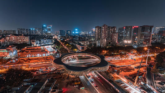 繁华城市夜景摄影照片_深圳城市夜晚十字路口密集车流