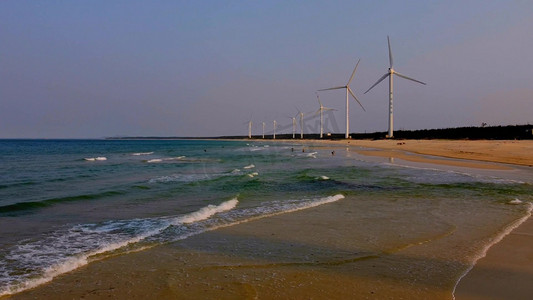 环保宣传册设计摄影照片_文昌市木兰湾风车和海岸风光