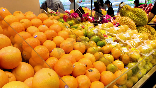 水果超市促销摄影照片_高清实拍超市里的新鲜桔子