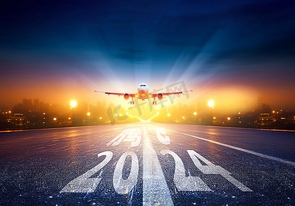 新年摄影照片_城市机场夜晚2024马路飞机起飞摄影图配图