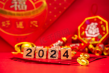 春节过年2024红色背景上摆放摄影图配图
