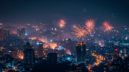 烟花摄影照片_夜晚城市美丽的烟花新年春节除夕