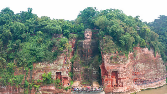 卡通手绘佛像图摄影照片_航拍四川乐山大佛佛像旅游景点