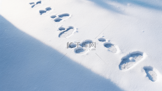 冬天雪地里的脚印背景图