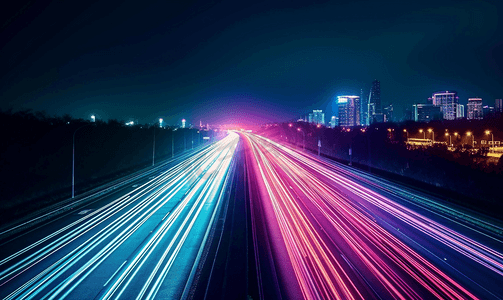 公路夜景摄影照片_公路在城市景观霓虹灯光
