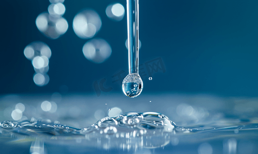 科技水滴摄影照片_化学实验滴管滴下液体水滴特写