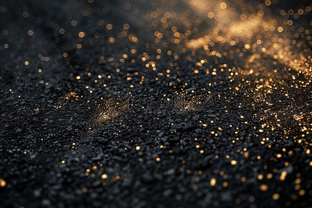 黑色混凝土表面的金色颗粒素材