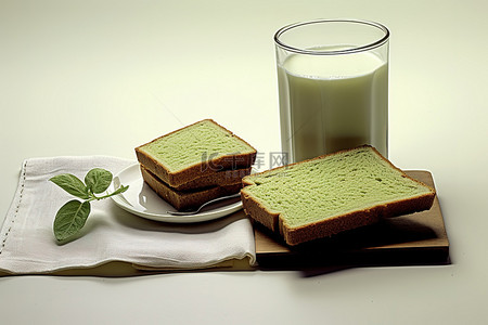 拿铁茶背景图片_绿茶面包片和一杯牛奶