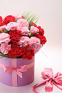 粉红色礼盒中的康乃馨花