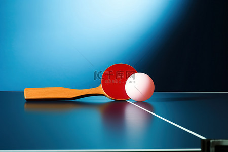 球赛背景图片_蓝色桌子上的乒乓球拍和球