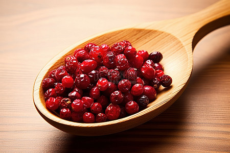 木勺调料背景图片_木勺里的红蔓越莓