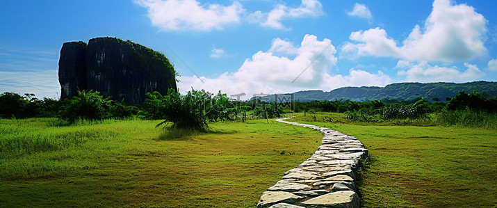 小路背景图片_背景中有草和大石头的小路