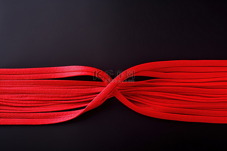 弹力拉拉裤背景图片_一根红色的弹力绳被切成两股