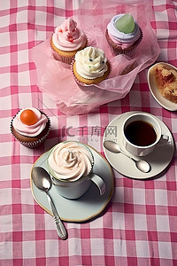 地摊奶茶背景图片_桌面上放着一杯茶和几个纸杯蛋糕