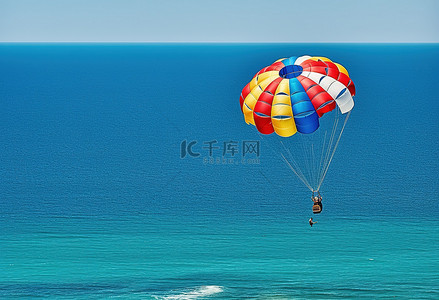 滑翔伞手绘背景图片_水中滑翔伞的人