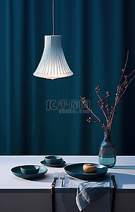 银色的背景图片_一张蓝色的桌子上摆着一张银色的餐巾和两个盘子