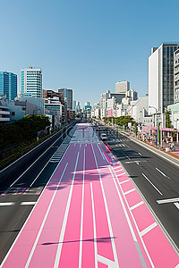 粉红色车背景图片_城市里一条粉红色的路是个奇怪的地方