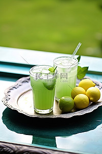 果盘介绍背景图片_白盘上的绿色饮料