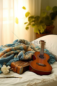 床上放着尤克里里吉他和毯子