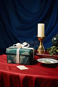 一张白桌子上放着一个礼盒红色礼物和一支蜡烛