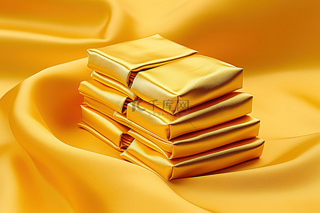 金条背景图片_金色丝绸织物上的一堆金条