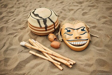 藤背景图片_沙子里的杂耍面具和藤制乐器