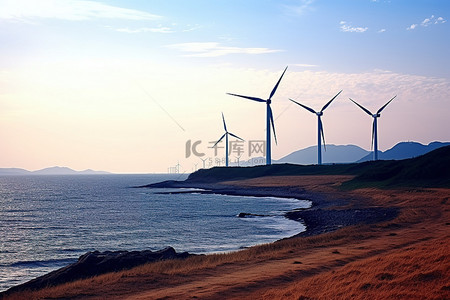 陆地和海洋背景图片_风力涡轮机矗立在海洋旁边，背景是水和陆地