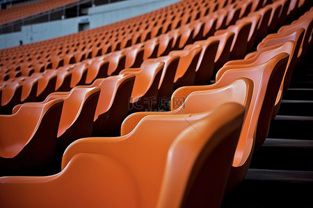 橙色的足球座椅被用来建造一个空荡荡的体育场