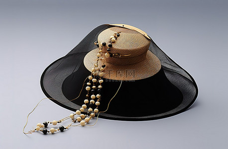 枕头上背景图片_白色枕头上有木珠和黑色网布的古董风格帽子