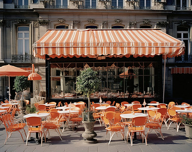 广场椅子背景图片_街上的一家户外咖啡馆