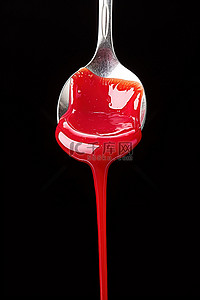 容器液体背景图片_装满红色液体的勺子