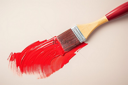 红色画笔涂色背景图片_白色表面上涂有红色粗笔画的画笔