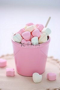 彩色棉花糖背景图片_粉色杯子里的彩色棉花糖