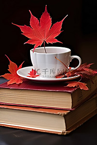 书本上背景图片_书本上的杯子和咖啡杯红枫叶