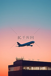层次的天空背景图片_一架飞机飞越机场和建筑物