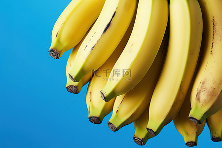 福利蓝色背景图片_蓝色背景上的一串香蕉