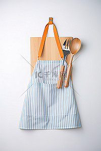 围裙背景图片_木桌上围裙里的烹饪工具