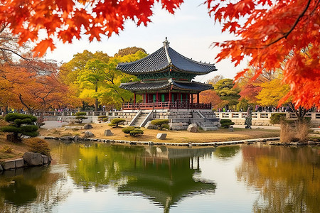 红色秋日里有雕像树木池塘和建筑物的公园