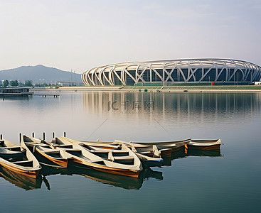 综合背景图片_奥林匹克体育场前的水面上停泊着几艘船