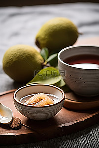 红毛丹背景图片_一碗冰红毛丹茶和另一碗上面有水果