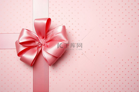 背景淡粉色背景图片_淡粉色背景上带有粉色丝带的优雅粉色包装蝴蝶结