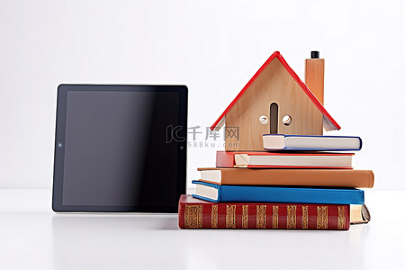 一个 ipad，装在书本和房子顶部的盒子里