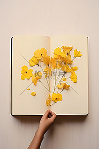 手工从日记本上剪出花朵到木头上