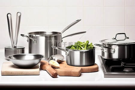 厨房菜板背景图片_厨房柜台上摆满了一些炊具和不锈钢容器
