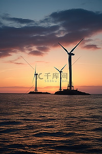 日落时海洋中的四个风力涡轮机