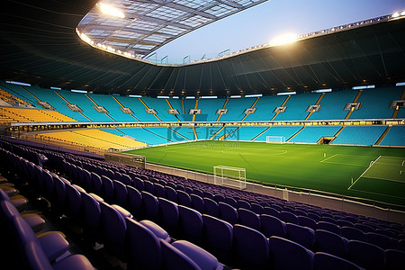 足球背景图片_一个空荡荡的足球场，有蓝色的座位