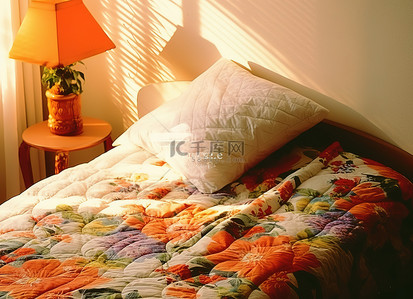 床上用品排版背景图片_床上盖有彩色图案的被子
