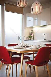 红色烛台背景图片_现代厨房里摆着一张餐桌，配有红色椅子