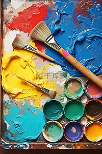 画中的背景图片_白色颜料盒中的一幅画，里面有各种颜色的颜料和画笔