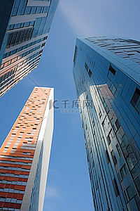 现代建筑高楼背景图片_背后是两座不同颜色的现代高楼